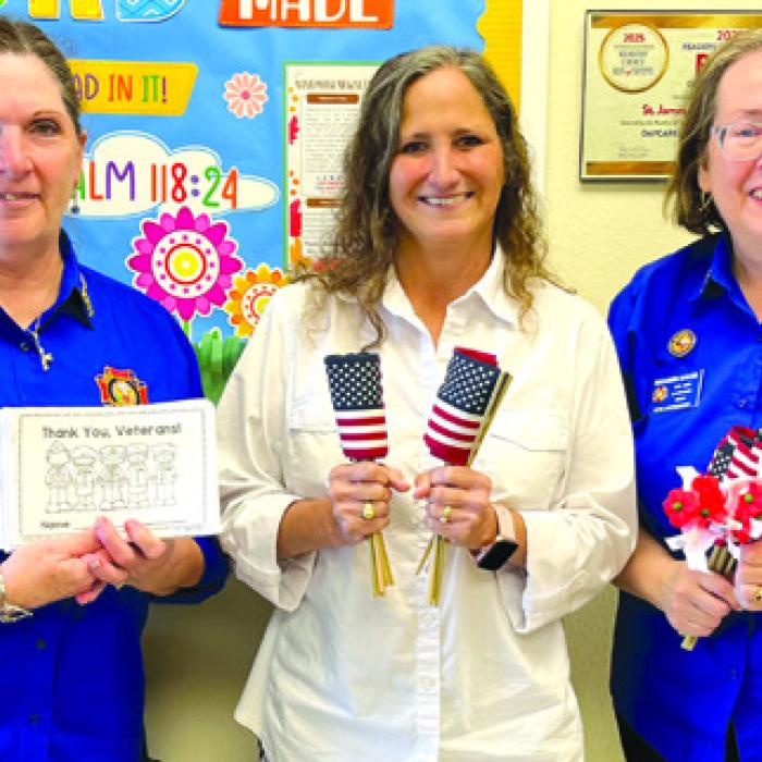 VFW Auxiliary 5254 of La Grange presented U.S. flags, “Buddy” poppies, and Veterans Day coloring books to St. James Episcopal and First Light pre-school campuses for Veterans Day activities. From left, VFW Auxiliary secretary/historian Becky Leer, Pre-School Director Laurie Krupala, and VFW Auxiliary Jr. Vice President Elizabeth Kallus.