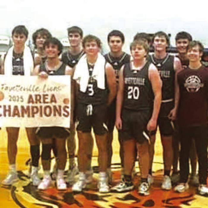 The Fayetteville basketball team poses after Friday’s victory.