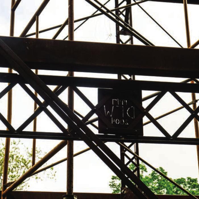 A metal cutout attached to the bridge reads DFW 1949-2004. Pct. 2 Commissioner Luke Sternadel said it was placed there two decades ago in memory of the late Donnie Frank Watkins of Carmine, who loved to fish at this spot on Cummins Creek.
