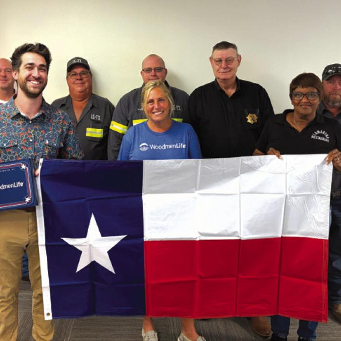 Pictured from left: Brett Wolf, Caleb Parks, Don Jakobeit, Andy Blaha, Cami Dixon, Officer David Gilbreath, Jan Dockery, and Clint Nichols.
