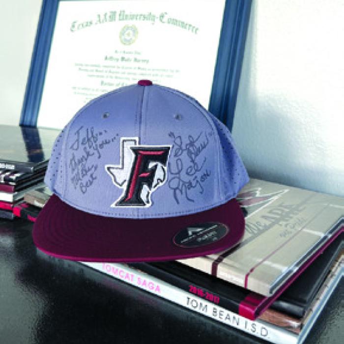 Dr. Harvey’s autographed baseball cap.