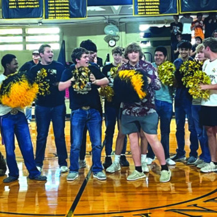 The male RTC athletes grabbed pom-poms and led a cheer for the team during the pep rally.