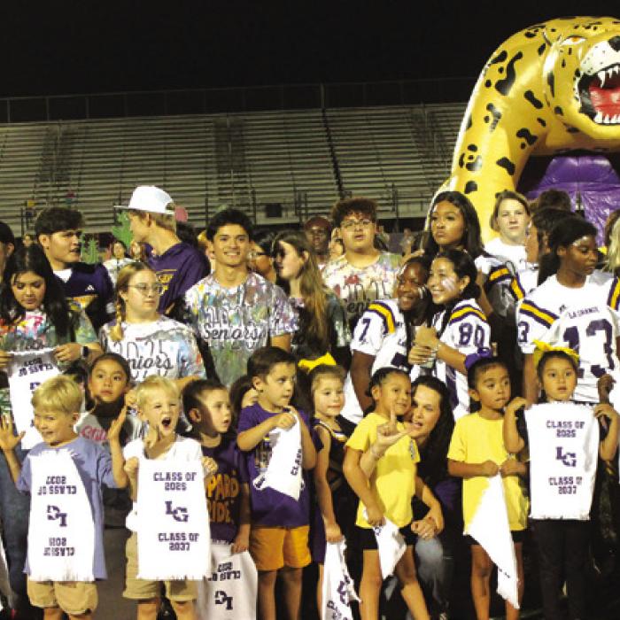 At Wednesday’s community pep rally the members of the senior class exchanged spirit towels with kindergarteners. The towels read “Class of 2025” and Class of “2037.”