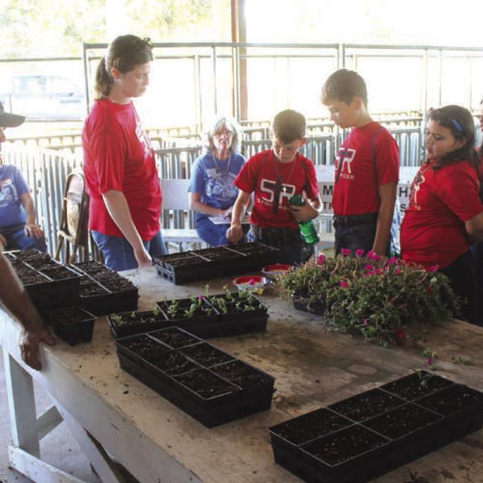 At Doug Janda’s station, students got to plant seeds.