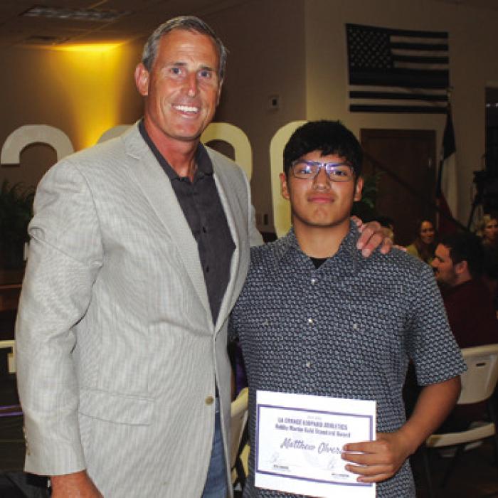 The Bobby Martin Gold Standard male award winner (named after an LHS employee who passed away this year) was Matthew Olvera, right, presented by coach Kyle Cooper.