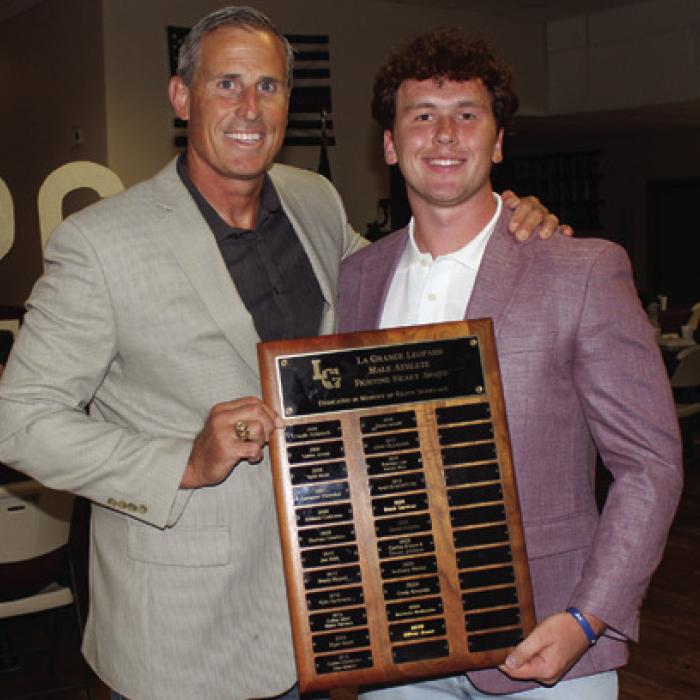 The La Grange Male Fighting Heart Award winner was Oliver Gunn, right, presented by Coach Kyle Cooper.