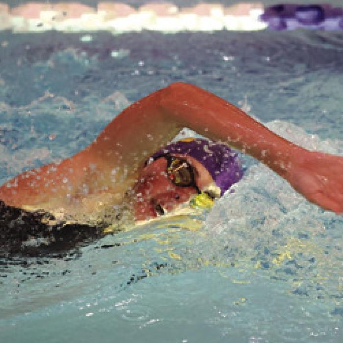 Adysen Janacek is shown here breaking the 200 yards freestyle record with a time of 2:22.07. Photo by Katy Michalke