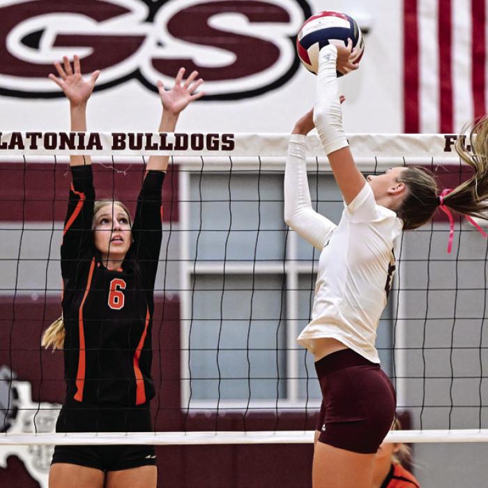 Schulenburg’s Clare Magliolo, left, and Flatonia’s Summer Sodek battle at the net in Saturday’s district volleyball match. Photo by Stephanie Steinhauser