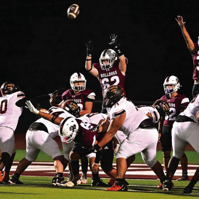 Flatonia players jump to try to block a Schulenburg extra point Friday. Photo by Stephanie Steinhauser