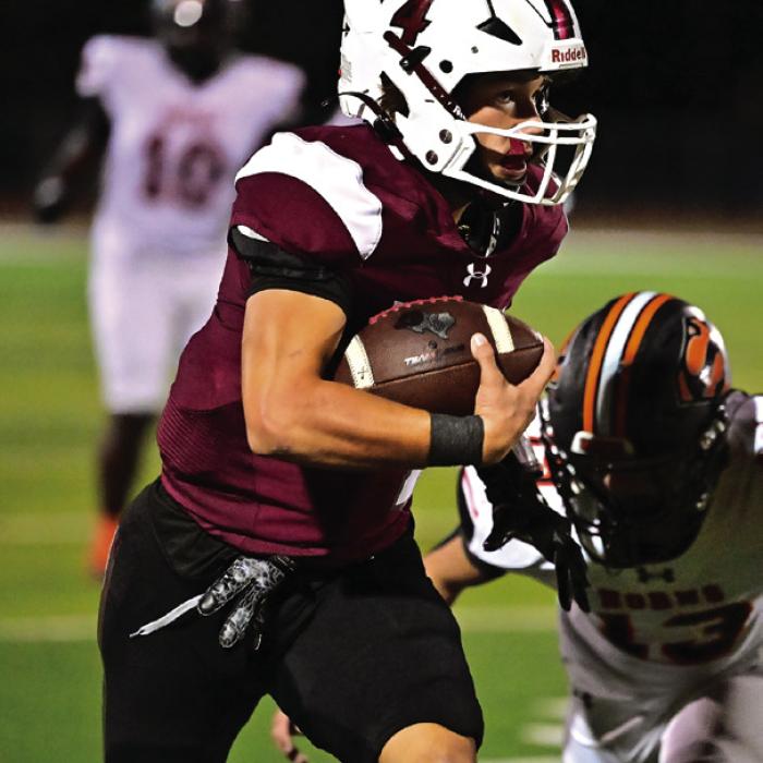 Senior Quarterback Beck Zimmerman keeps the ball and makes a run to pick up first down for Flatonia in Friday night’s game against Schulenburg. Photo by Stephanie Steinhauser