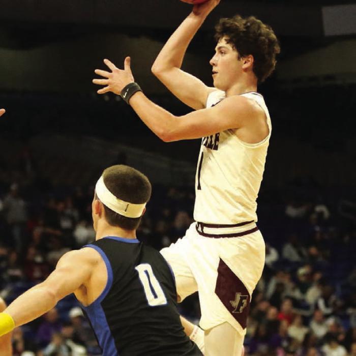 Mason Fenhaus drives the lane to score a jumper in the fourth quarter. Fenhaus led the Lions in scoring with 18 points. Photo by Ken Sury