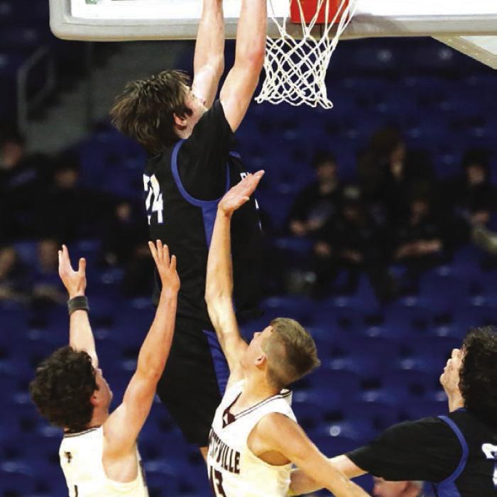 Turkey Valley’s Corbin Taylor, a 6-foot-8 sophomore, slams a dunk in the fourth quarter. Corbin Taylor finished with a gamehigh 26 points while his senior brother Kanyon added 18 for Turkey Valley’s first state championship. Photo by Ken Sury