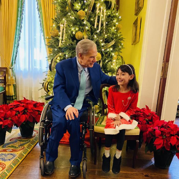 Governor Greg Abbott visits with Reeanna Ramirez, a secondgrader at Sacred Heart School, during a visit to the Governor’s Mansion with her uncle Michael Schlabach last Friday.