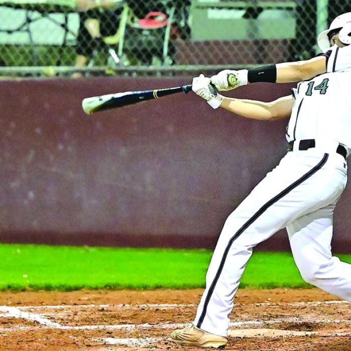 Raymond Toro hits to deep center for a triple in Monday’s game against Gonzales. The Bulldogs pulled out a convincing win for the home crowd. Photos by Stephanie Steinhauser