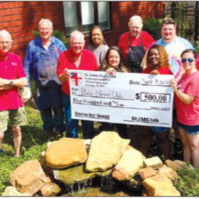 The Holy Smokers cooked for the Boys and Girls Club. Pictured left to right are Columbus Club Director Royce Caldwell, Jim Gilley, Jim Austin, Ed Dykes, Bill Rugeley, Administrative Assistant Olivia Wettstein, Weimar Club Director Anita Cook, Richard Dixon, Executive Director Jennifer Owens, Schulenburg Club Director Nikita Glass, Club Coordinator Brian Novak, Dan Boyles and Jim Malik.