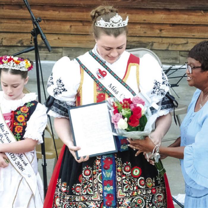 Before the performance, La Grange Mayor Jan Dockery, right, read a proclamation recognizing La Grange native and reigning Miss U.S. Czech-Slovak Queen Madelyn Karstedt, center. They were joined on stage by Karstedt’s sister, Lille Karstedt, the Texas Czech-Slovak Princess, left.