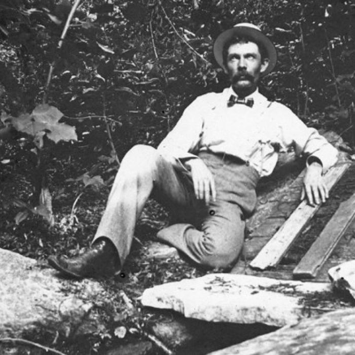 Labeled “Bluff Spring,” Frank Hausmann is shown on the farm belonging to his father, Franz Hausmann. They put the rock ledge over the springs and then the wooden cover and used it like a spring house to keep food cool. Photo courtesy of the Fayette Heritage Museum &amp; Archives