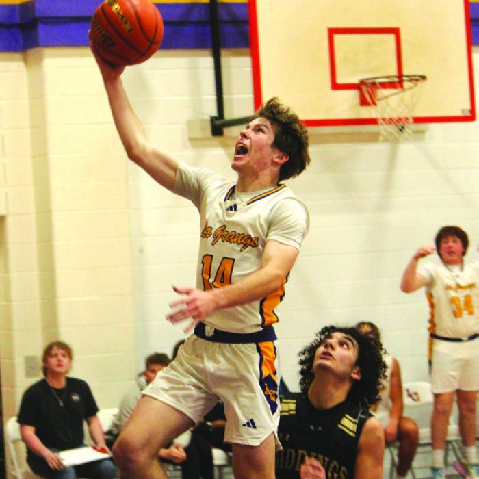La Grange’s Cordale Knapik drives to the basket for two points Friday. He scored 10. Photos by Jeff Wick
