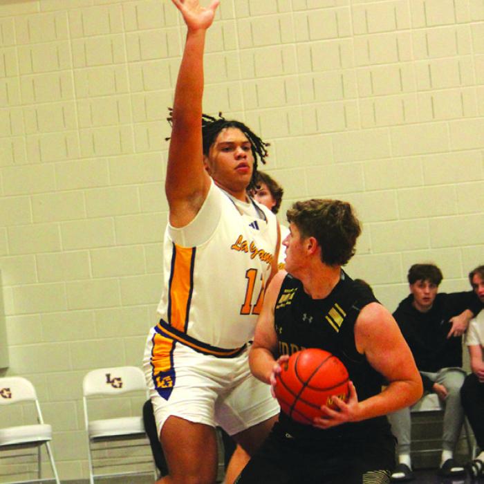 La Grange’s Devonte McKenzie plays some tough defense against this Giddings ballhandler. McKenzie scored eight.