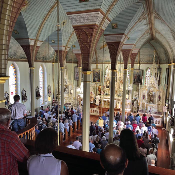Bishop Brendan Cahill celebrated Mass Friday morning at St. Mary’s Church in Praha in front of a standing-room-only crowd that had some faithful finding benches up in the choir loft. Photos by Jeff Wick