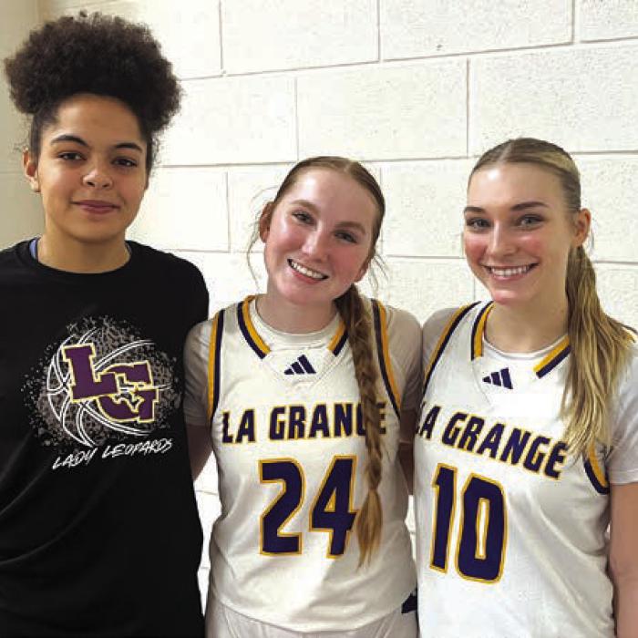 The seniors on the district championship La Grange girls basketball team, left to right, manager LaDonije Lewis, and starters Ella Nygren and Kylie Trlicek. Photo by Jeff Wick