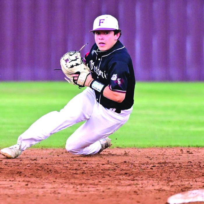Nathan Aguillion stops a hard hit grounder behind second base in Tuesday’s 7-3 win over Ganado. Photo By Stephanie Steinhauser
