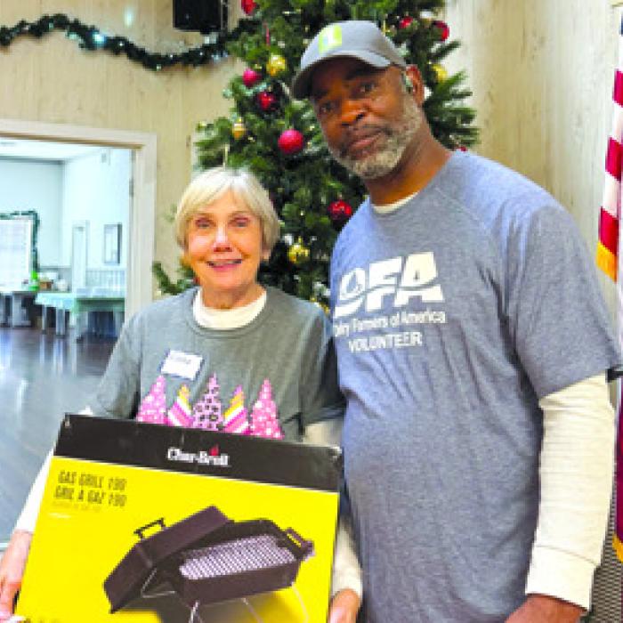 Elena Horndt was the lucky winner of this tabletop grill donated by Dairy Farmers of America, presented by Leon Brooks.