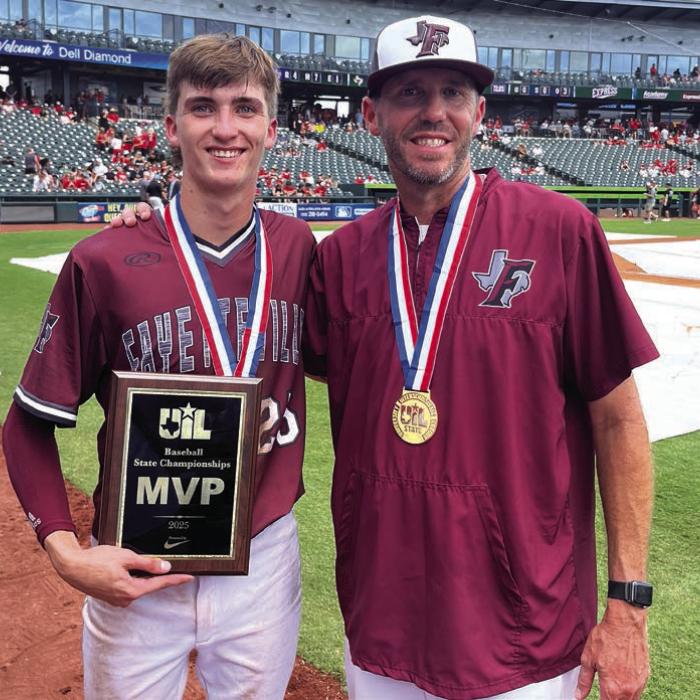 Fayetteville senior shortstop Easton Jaeger, left, poses with his dad, Clint, the head coach of the Lions, after they won the state title Saturday in Round Rock. Photo by Jeff Wick