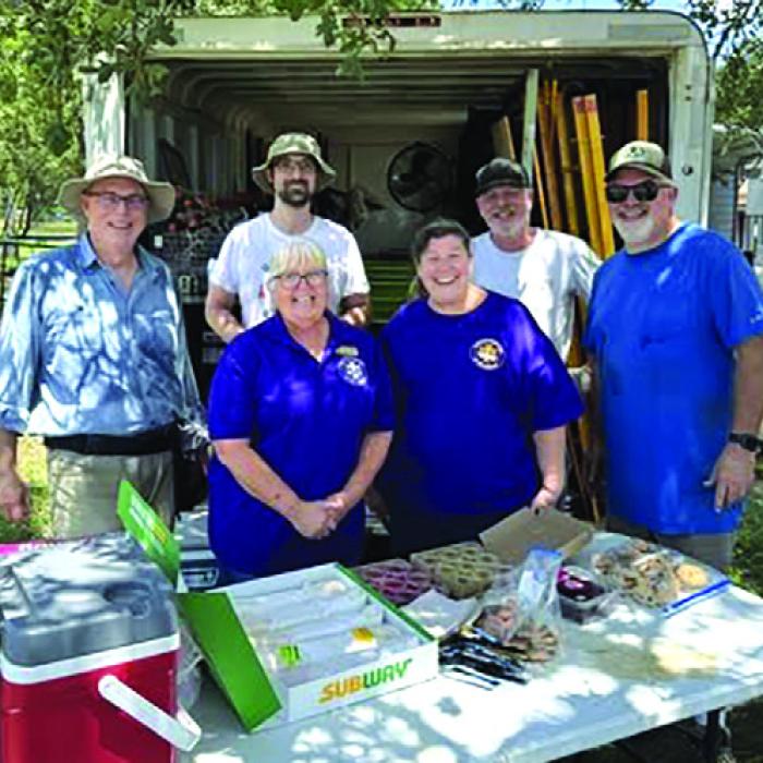 Phyllis Valchar, Grace Lebeda, and representatives from Fayette County Habitat for Humanity.