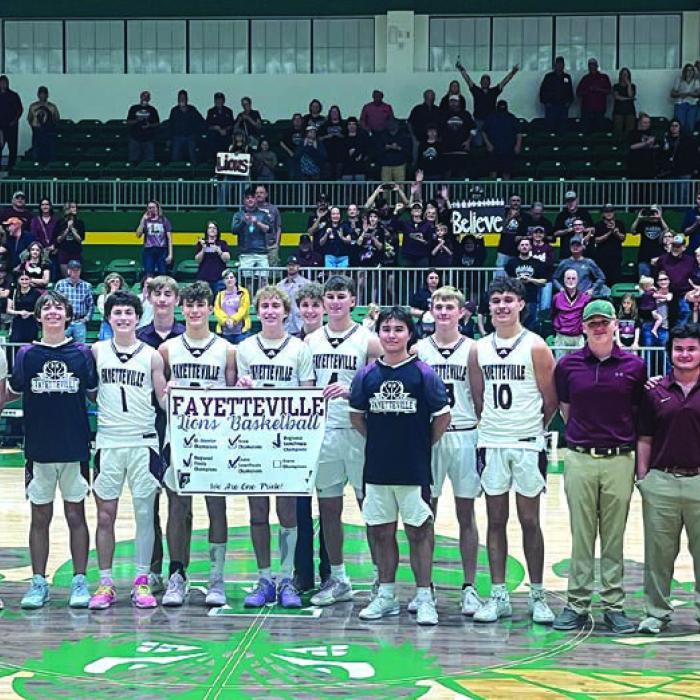 The Fayetteville Lions pose after their win Monday in the state semifinals. Photo by Jeff Wick