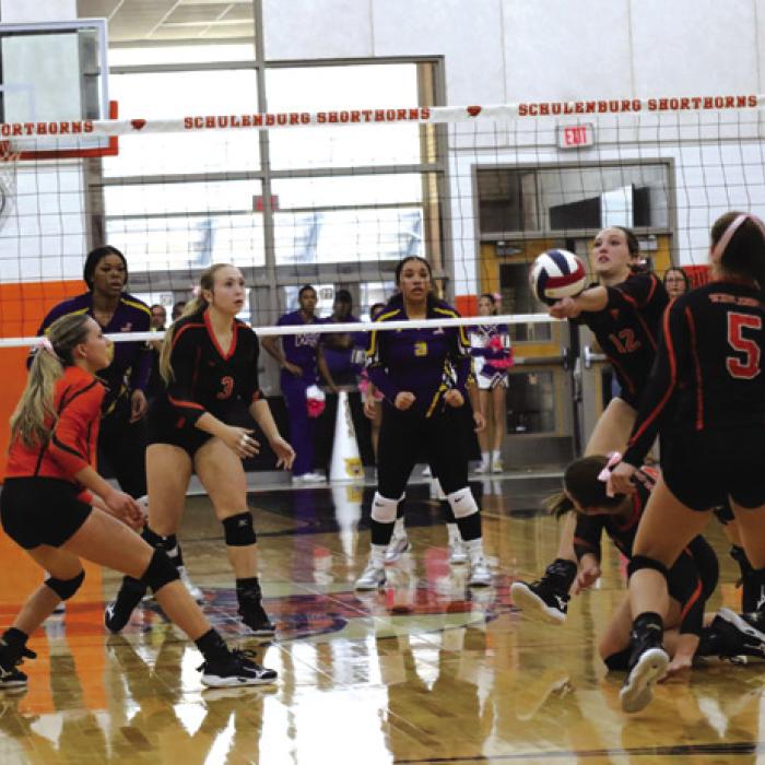 Schulenburg’s Grace Schramek saves a ball in Friday’s match against Weimar. Photo by Audrey Kristynik