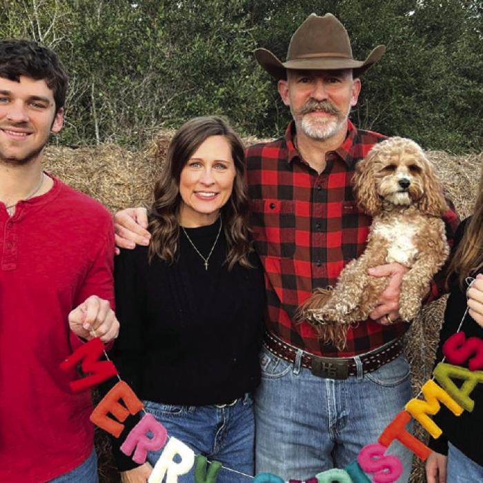 The Hooper family, left to right, Jack’s picture is held by Will, DeeAnn, Chris and Cate.