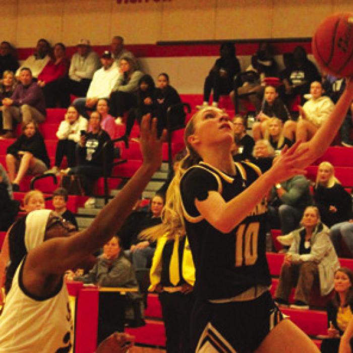 La Grange’s Kylie Trlicek drives to the basket as she scores part of her team-high 21 points Tuesday.