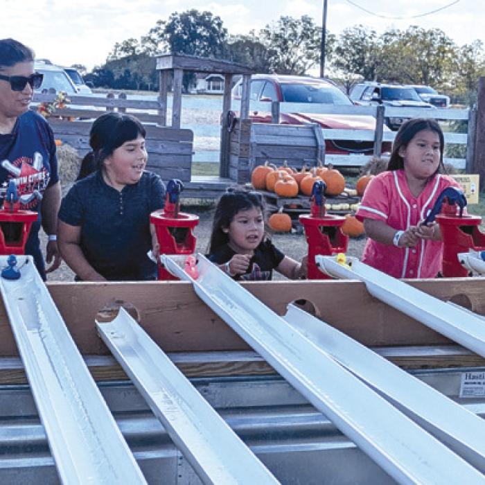 A Turtle Wing family enjoys fun games at Rock Creek Corn Maze.