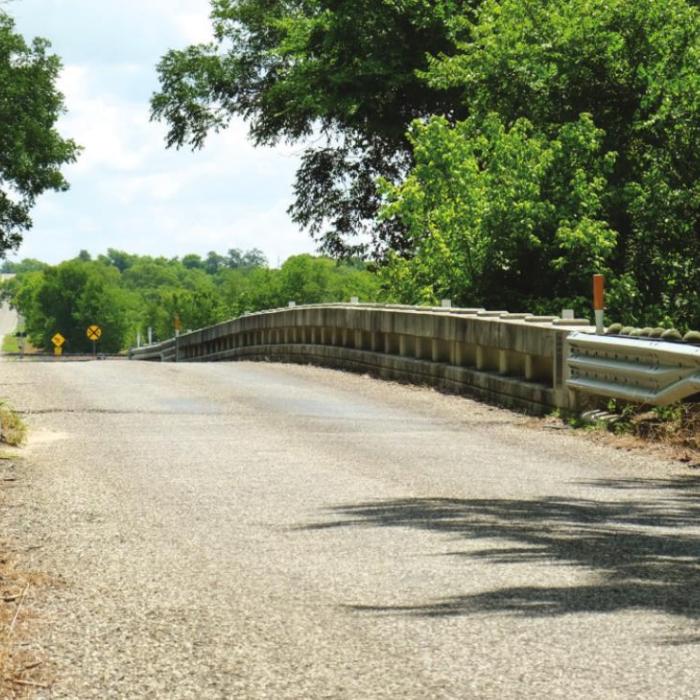 The bridge across the East Navidad River on FM 1579 was built 100 years ago as part of the Old Spanish Trail Highway, which later became US Hwy. 90. Photo by Andy Behlen