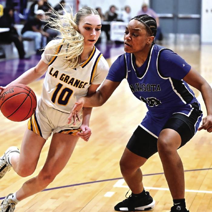 Kylie Trlicek drives in towards the goal for La Grange against some tough defense by Navasota. Photo by Stephanie Steinhauser