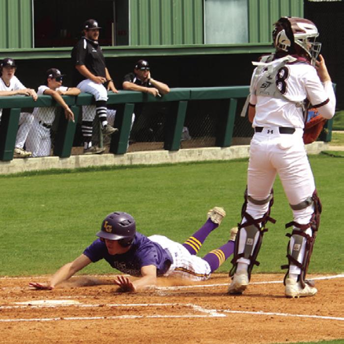 La Grange’s Colt Jobb slides into home plate last week against New Waverly.
