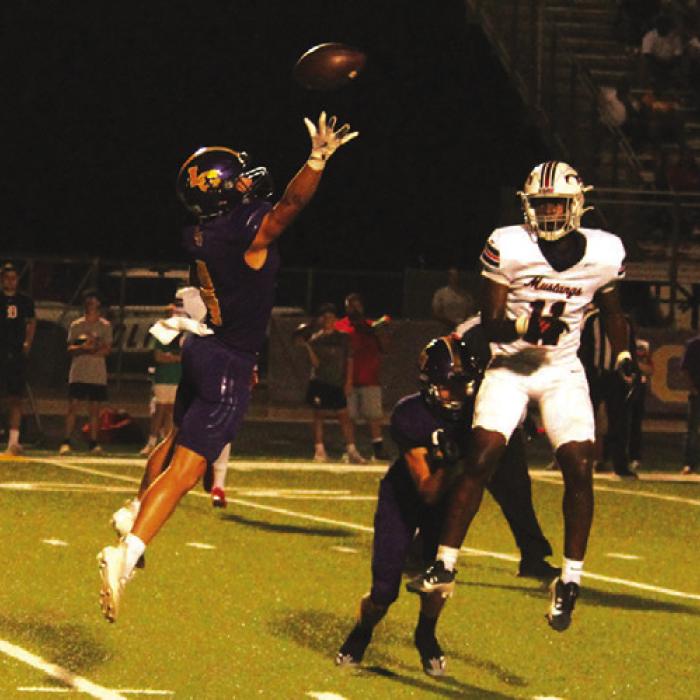 La Grange’s Eli Gillum leaps to try to make a play on an errant pass by Madisonville Friday.