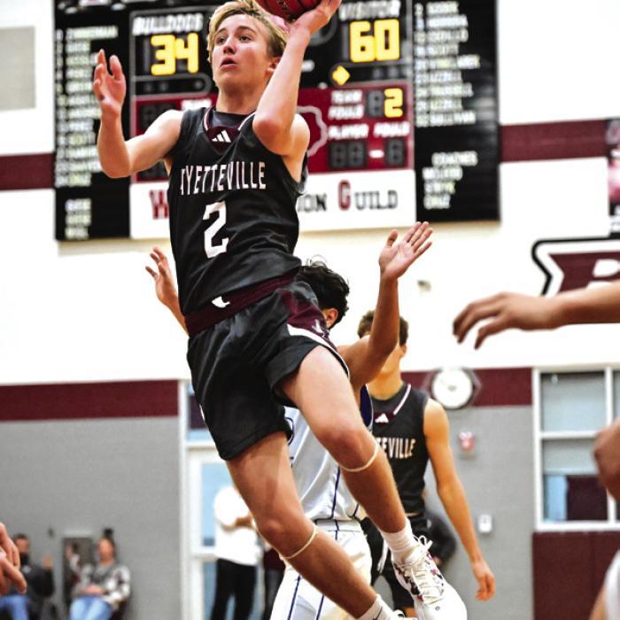 Fayetteville’s Kole Schmitt goes to the bucket in action Friday at the Fayetteville Tournament. The Lions beat Flatonia and Wealder in the tourney but lost twice to Rice Consolidated, including 76-68 in overtime in the tourney title game. Photo by Stephanie Steinhauser