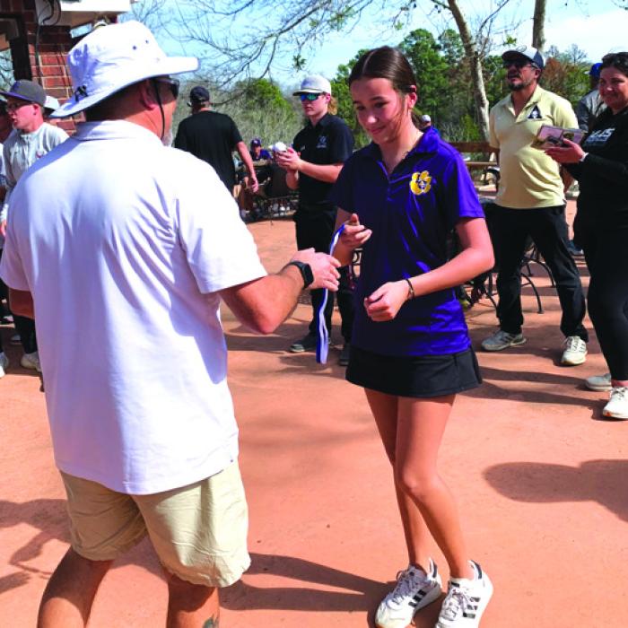 La Grange’s Briella Veitch receiving her 1st Place medal.