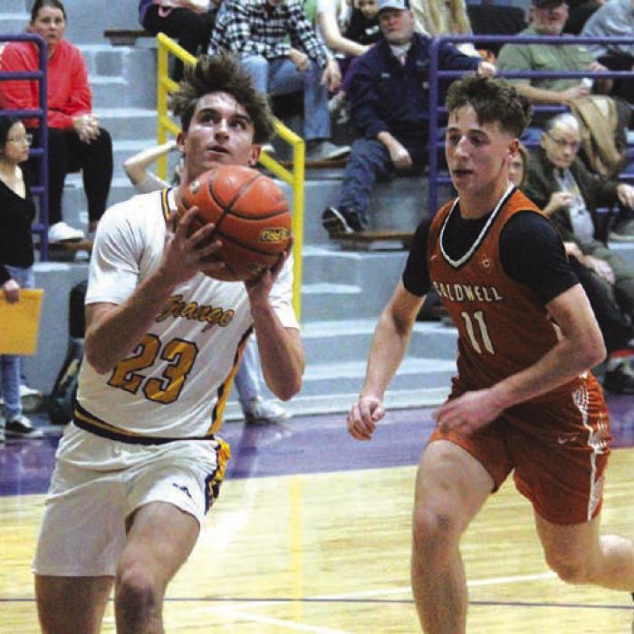 La Grange’s Mason Kleiber outraces a Caldwell player to the basket for two points Tuesday. Photo By Jeff Wick