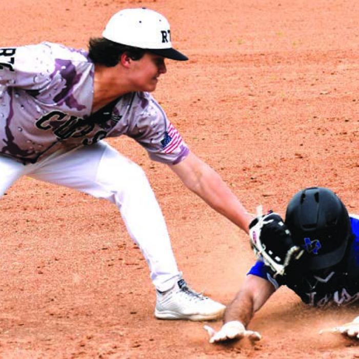 RTC’s Cash Robertson makes a tag on a Snook runner in Tuesday’s win. Photo by Paul Kipp