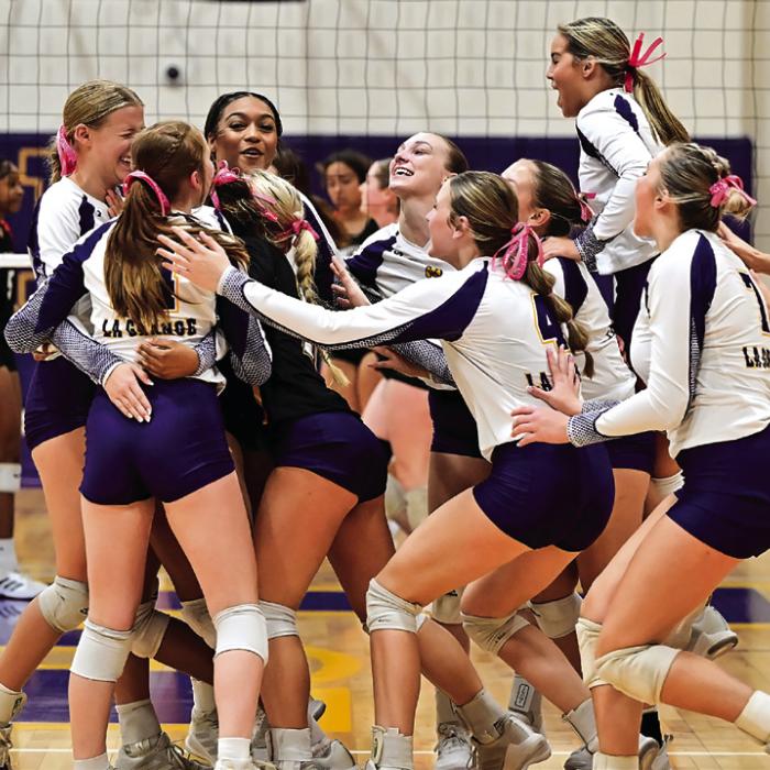 The Lady Leps celebrate after the final point of Tuesday’s victory over Smithville. Photo by Stephanie Steinhauser
