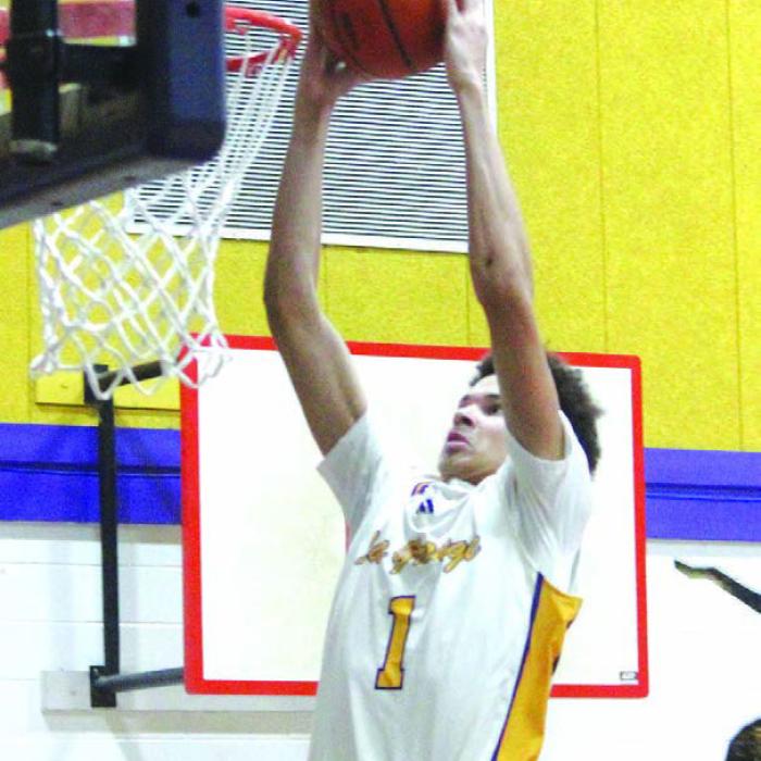 La Grange’s Brandon Mathis, 6-foot-8, goes up for one of his dunks in Friday’s win over Victoria East. Photo by Jeff Wick
