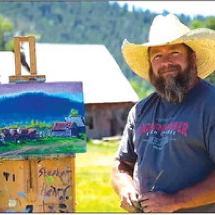 Stephen Henry with one of his plein air paintings.