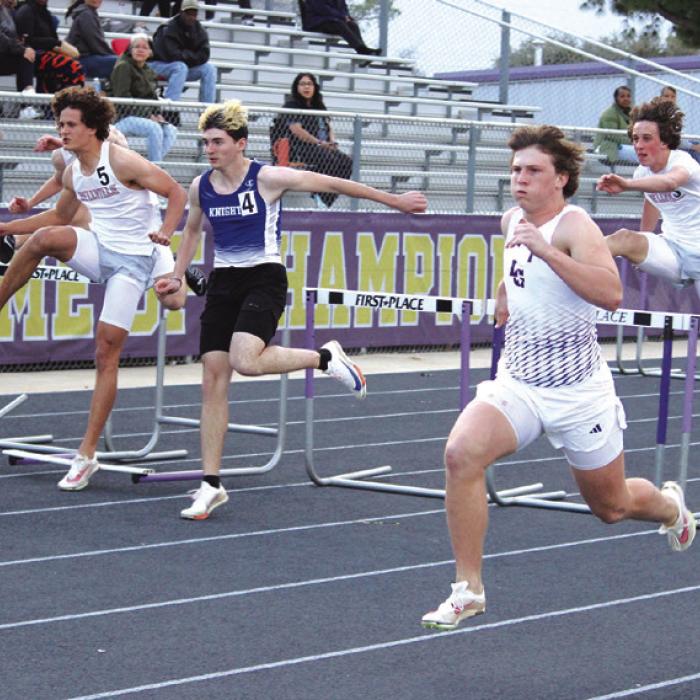 La Grange’s Clayton Cooper, shown here in the foreground at the recent La Grange Relays, won the 300 hurdles at the Columbus Meet. Photo by Jeff Wick
