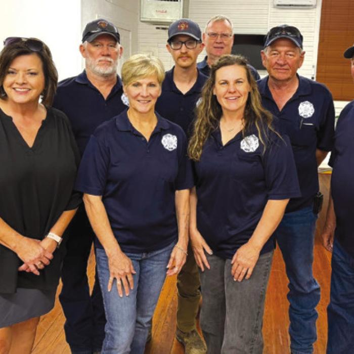 Newly elected Winchester Area Volunteer Fire Department officers from front left: Kelly Franke, Vice President; Sherry Murphy, Treasurer; Jacki Short, President; and Ron Kaiser, Secretary; back row: Nick Brooks, Fire Chief; Melvin Schulze, 2nd Assistant Chief; Ryan McGary, Training Officer; and Barry Zoch, 1st Assistant Chief. Photo bombing the photo is Chuck Breeden, new first responder.