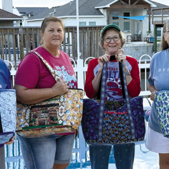 The ladies who completed their tote bags on the quilt retreat – Marian Tajchman, Kim Bonewald, Tricia Griste and Nancie Blair.
