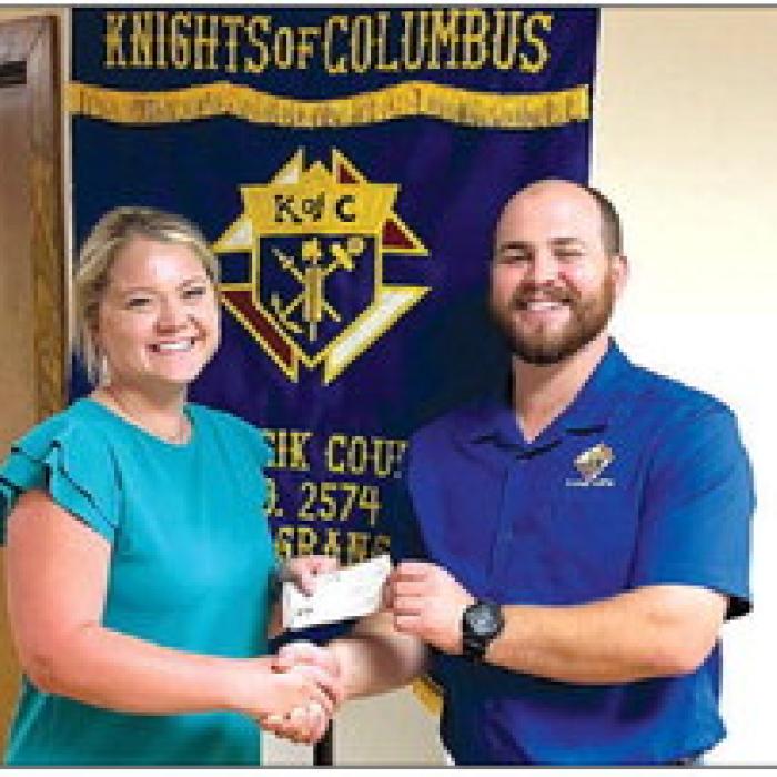Receiving a Knights of Columbus Scholarship in honor of Knights of Columbus Council No. 2574 members is Alyson Trlicek.