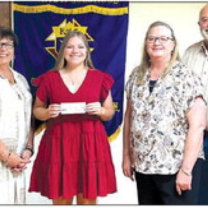 Receiving a Knights of Columbus Scholarship in honor of deceased member Tom Walker is Brynn Mikulenka.